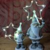 Kerstman met zilveren LED-ster